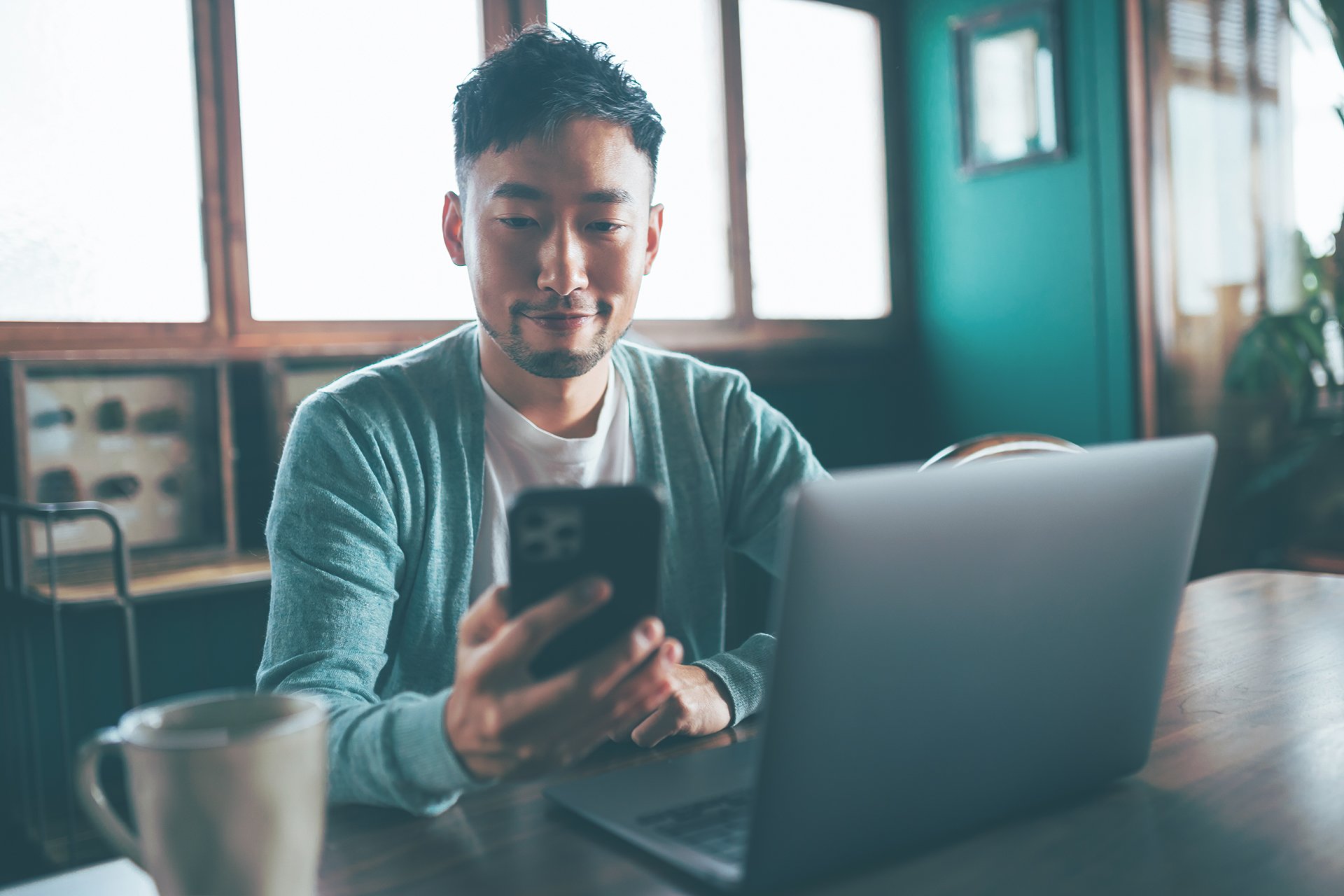 Man looking at this mobile phone